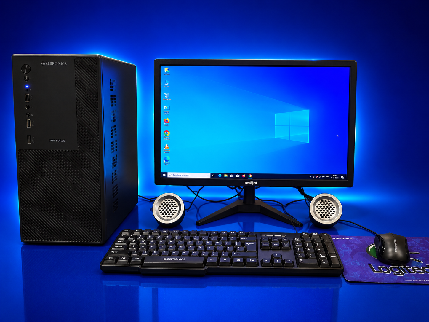 Zebronics desktop tower with Frontech monitor, keyboard and mouse set up on a desk